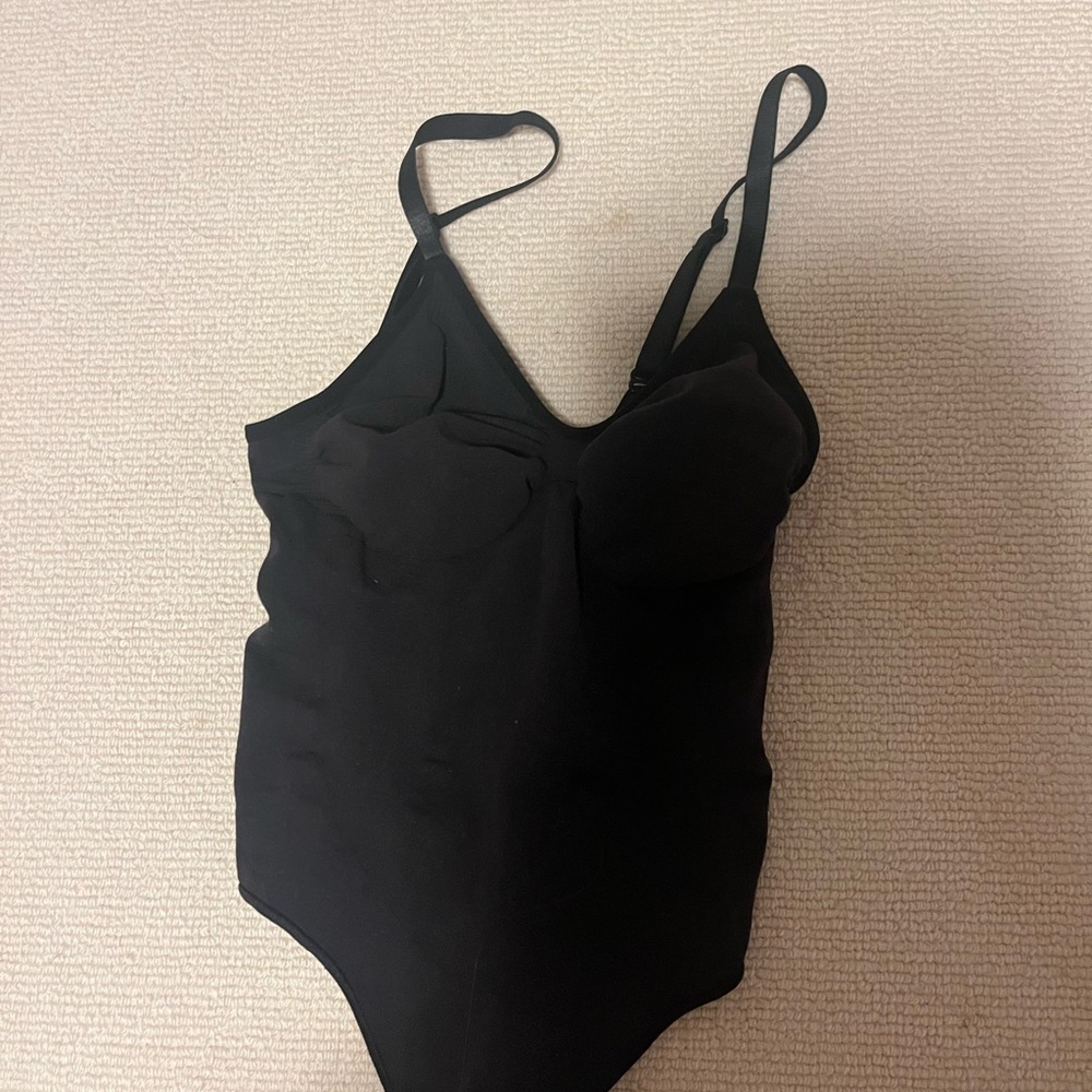 THE skims body suit